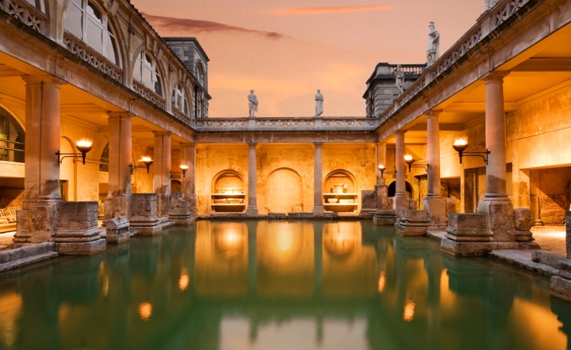 The Great Bath by torchlight at Roman Baths